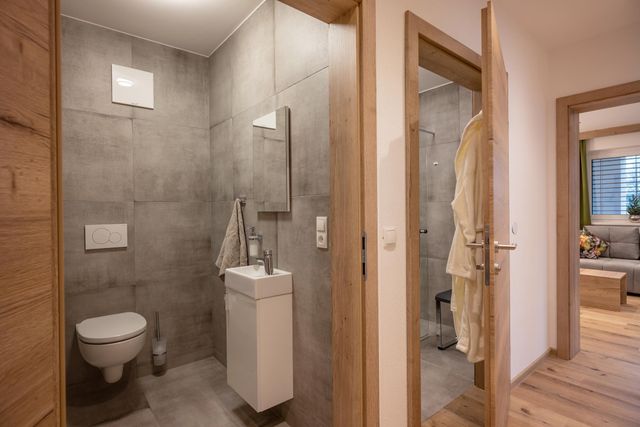 two bathrooms with shower and toilet